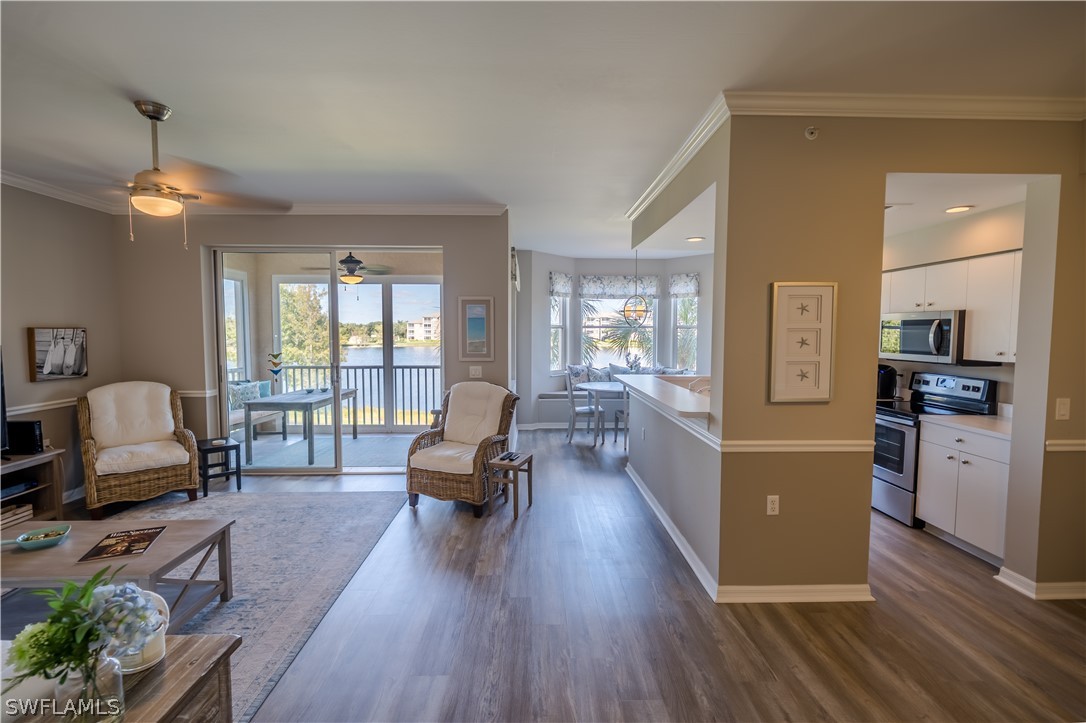 14101 Brant Point Circle, Unit 3203 Fort Myers, FL 33919 - Photo 2 of 34 a living room with furniture and a large window