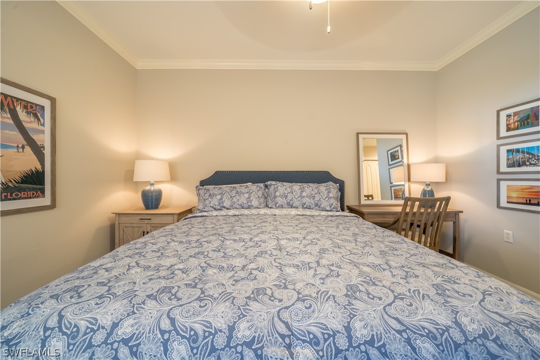 14101 Brant Point Circle, Unit 3203 Fort Myers, FL 33919 - Photo 23 of 34 a bedroom with a bed and a night stand