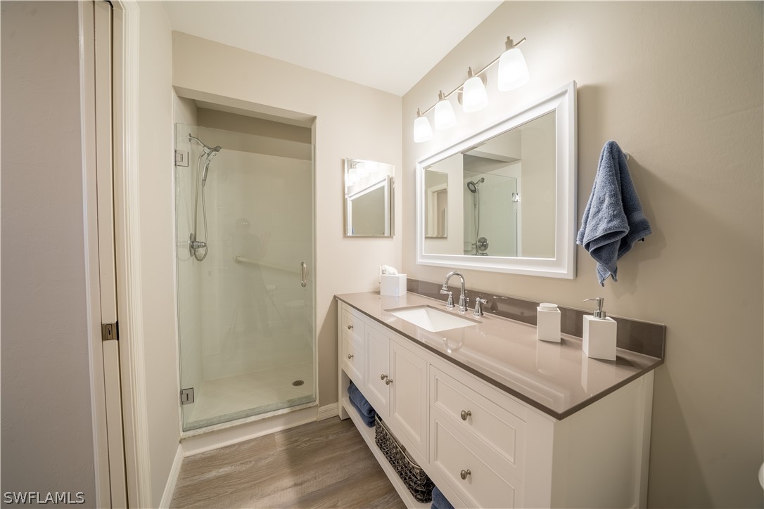 14101 Brant Point Circle, Unit 3203 Fort Myers, FL 33919 - Photo 25 of 34 a bathroom with a sink and a mirror