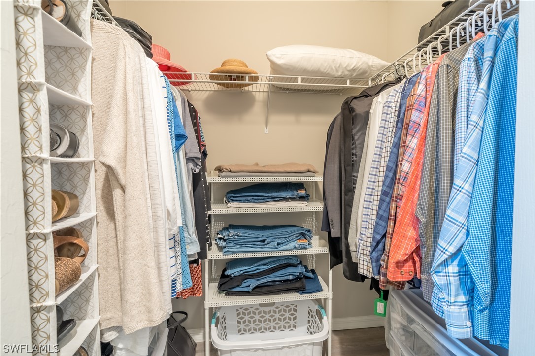 14101 Brant Point Circle, Unit 3203 Fort Myers, FL 33919 - Photo 26 of 34 a view of walk in closet with clothes and shoes