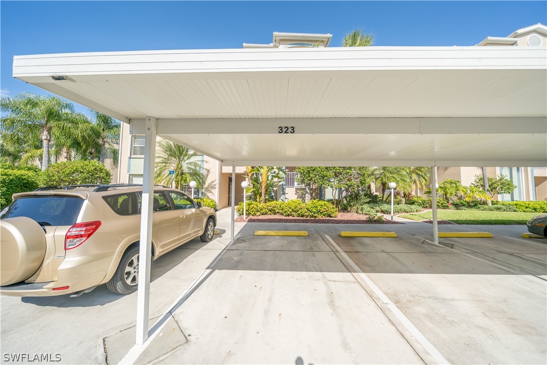 14101 Brant Point Circle, Unit 3203 Fort Myers, FL 33919 - Photo 32 of 34 a view of a patio with a table and chairs and potted plants