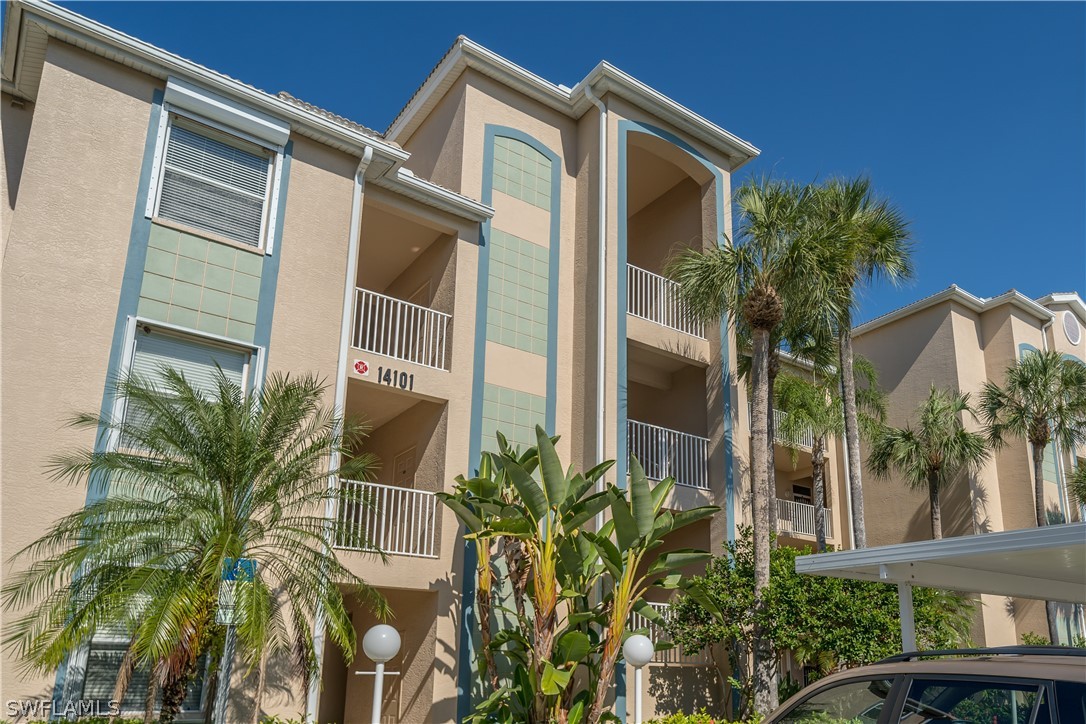 14101 Brant Point Circle, Unit 3203 Fort Myers, FL 33919 - Photo 34 of 34 a front view of a house with a yard