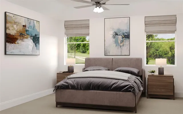 a bedroom with a bed and a painting on the wall