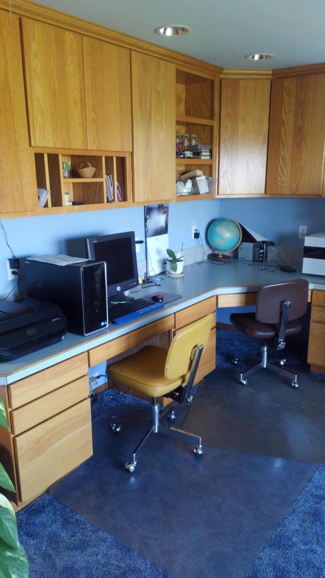 10043 Fort Road Wapato, WA 98951 - Photo 37 of 64 a room with wooden furniture and a wooden floor