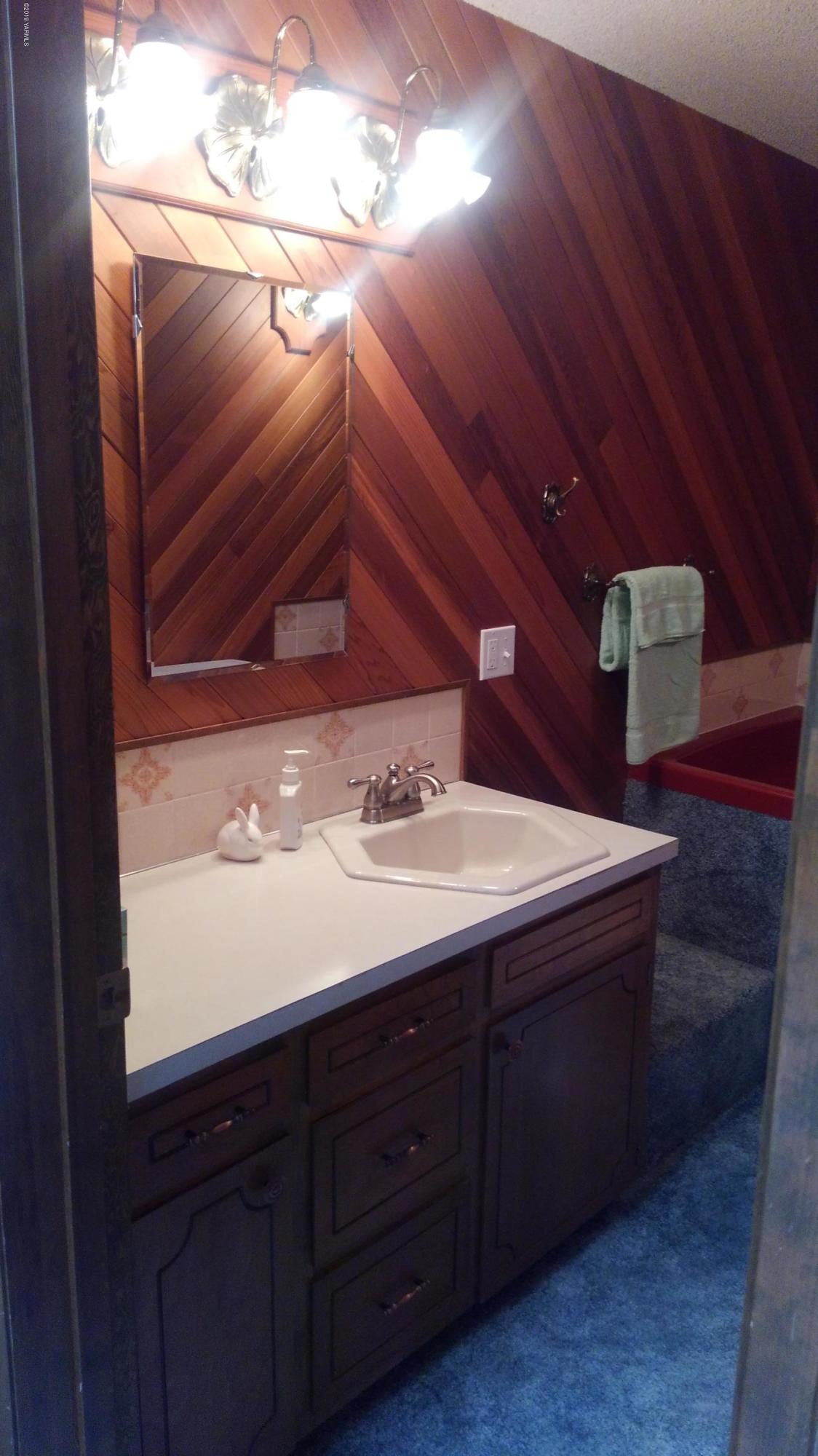 10043 Fort Road Wapato, WA 98951 - Photo 47 of 64 a bathroom with a sink and a mirror
