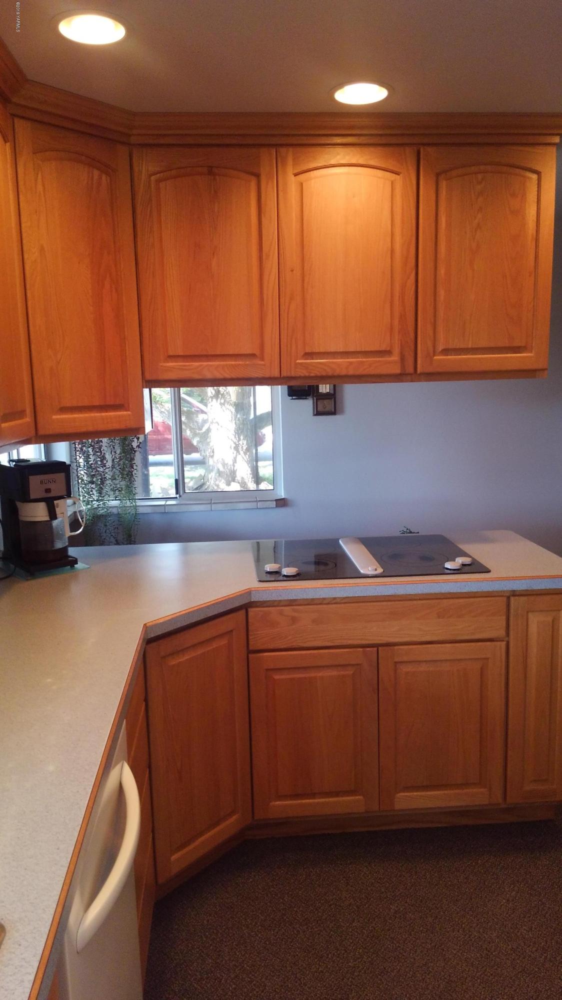 10043 Fort Road Wapato, WA 98951 - Photo 61 of 64 a kitchen with stainless steel appliances granite countertop wooden cabinets a sink and dishwasher