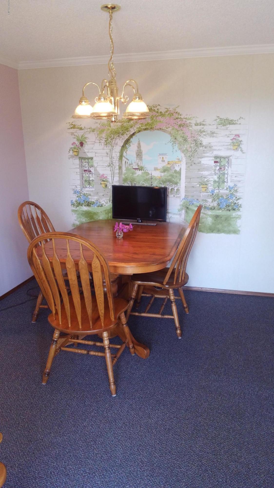 10043 Fort Road Wapato, WA 98951 - Photo 64 of 64 a dining room with furniture and chandelier