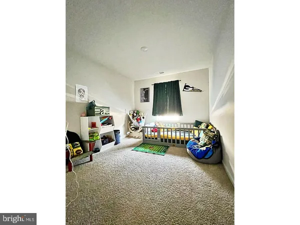 a children room with toys and flat screen tv
