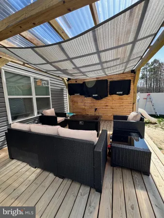 a view of a balcony with wooden floor
