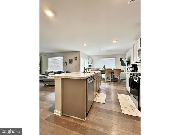a kitchen with refrigerator and cabinets