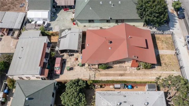 an aerial view of a house with a yard