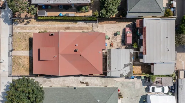 an aerial view of a house with outdoor space