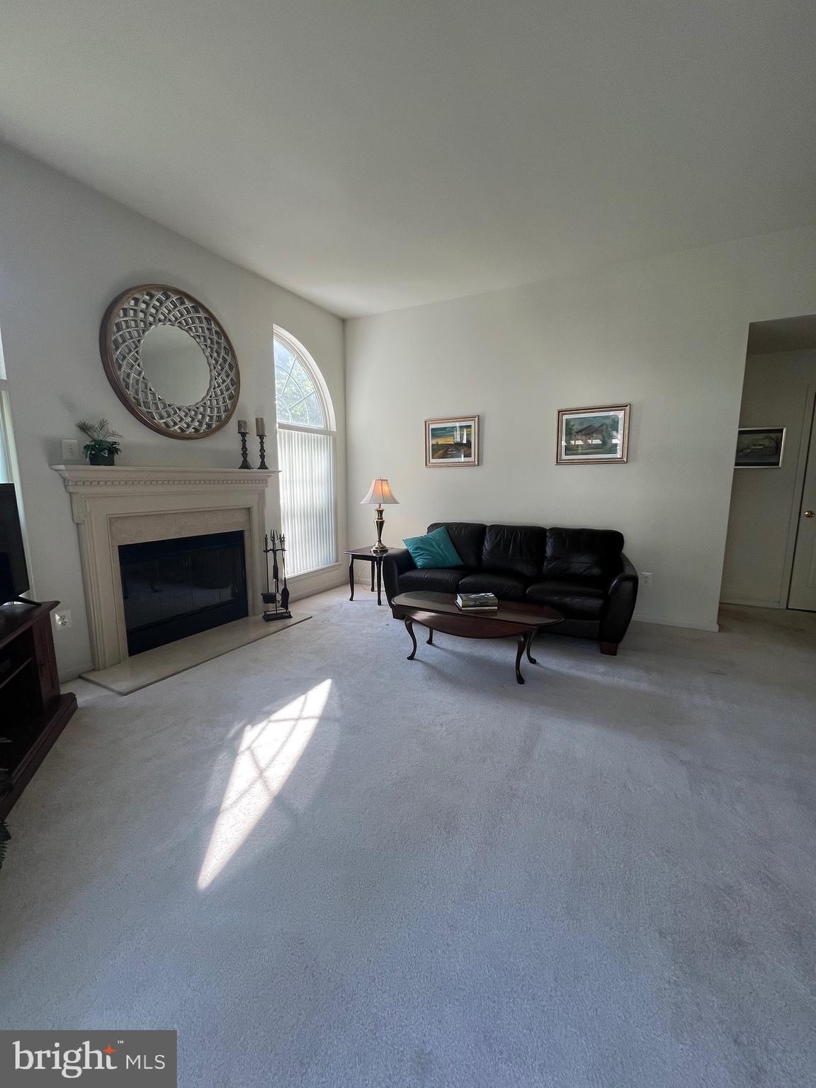 960 Butler Drive Williamstown, NJ 08094 - Photo 16 of 44 a living room with furniture a window and a fireplace