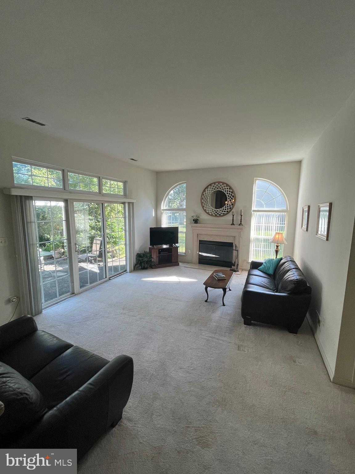 960 Butler Drive Williamstown, NJ 08094 - Photo 18 of 44 a living room with furniture and a fireplace