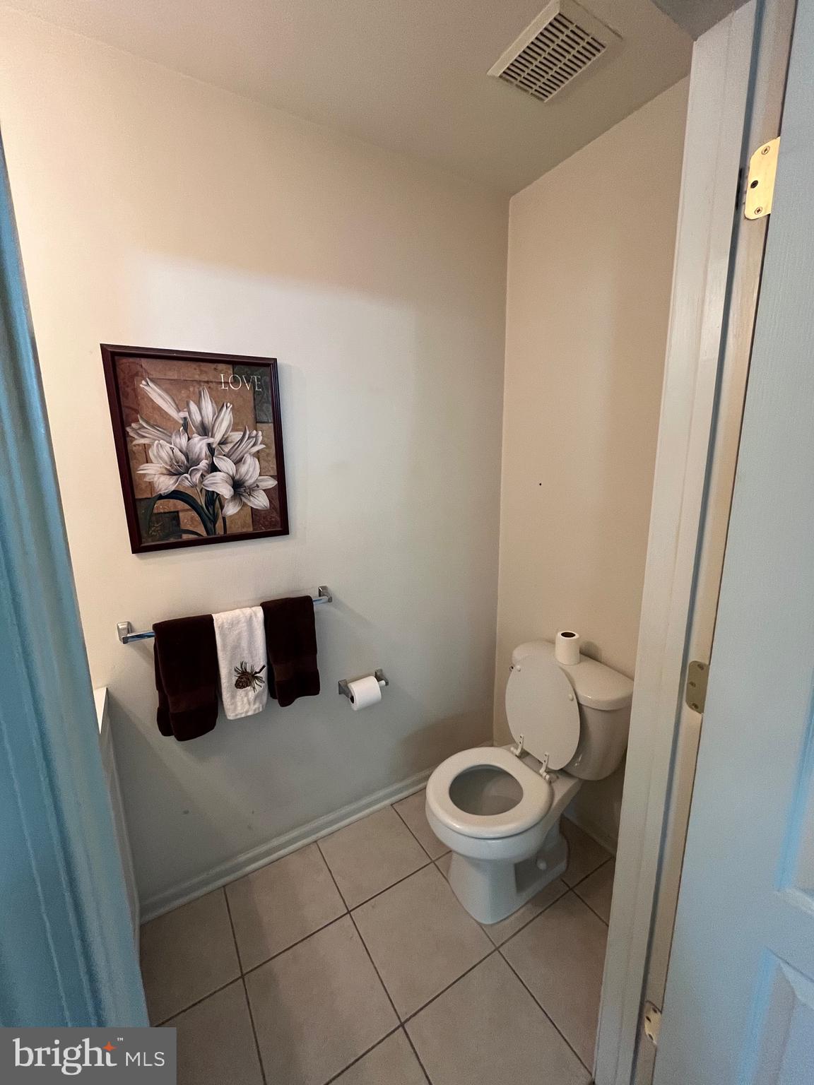 960 Butler Drive Williamstown, NJ 08094 - Photo 31 of 44 a bathroom with a toilet and a picture on the wall