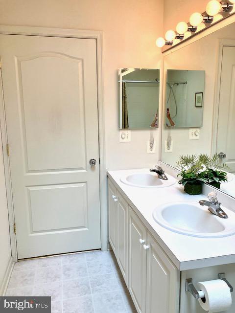 960 Butler Drive Williamstown, NJ 08094 - Photo 35 of 44 a bathroom with a sink and a mirror