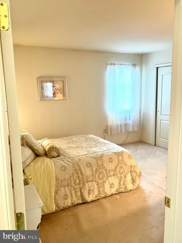 a bedroom with a bed and bathroom