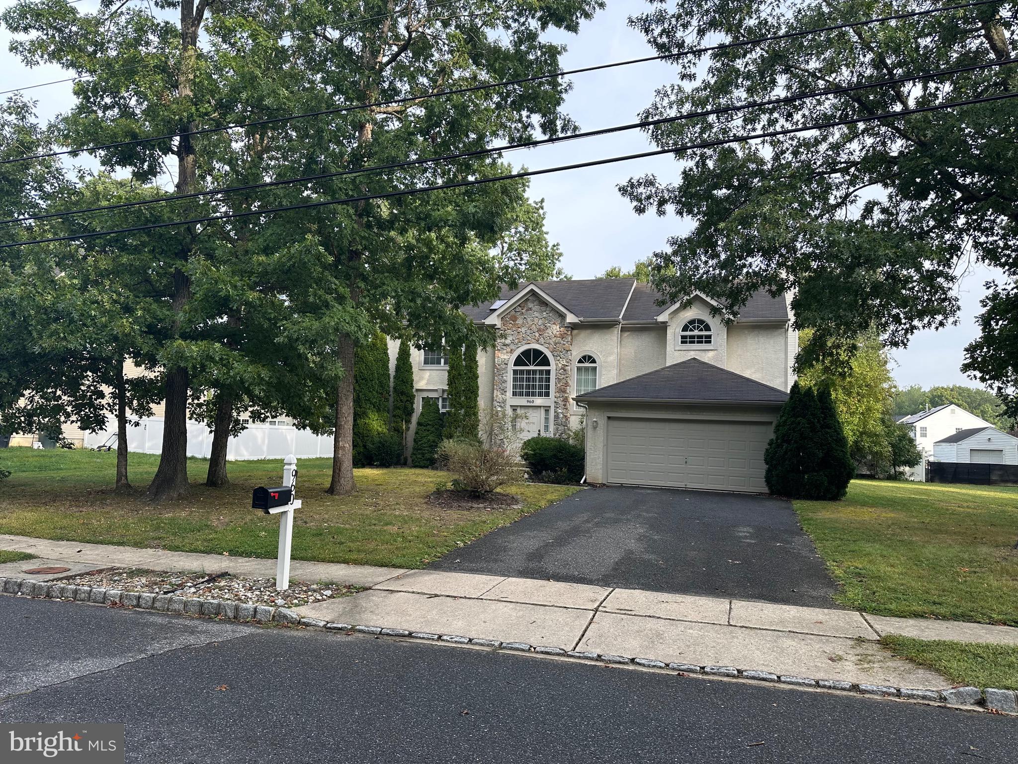 960 Butler Drive Williamstown, NJ 08094 - Photo 42 of 44 a front view of a house with a yard and trees