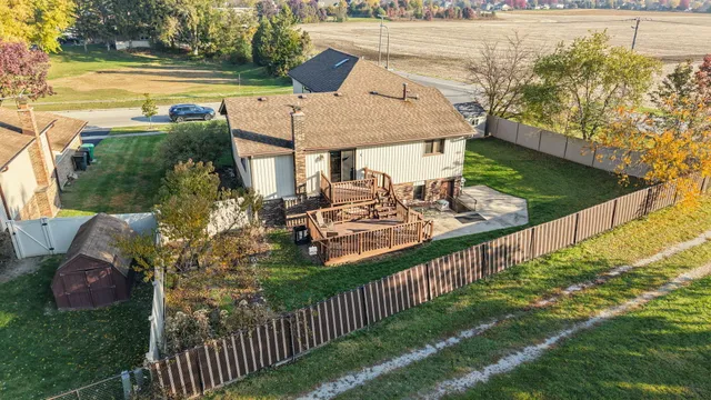 a view of a balcony with two chairs and a table
