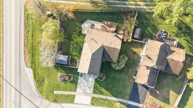 an aerial view of residential houses with outdoor space