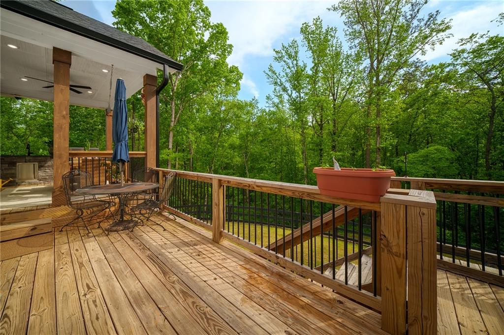 392 London Road Ball Ground, GA 30107 - Photo 24 of 53 a view of balcony with wooden floor and outdoor seating