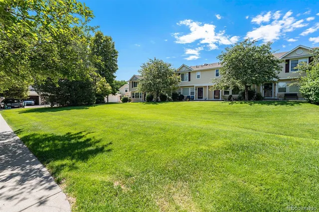 a view of a house with a big yard