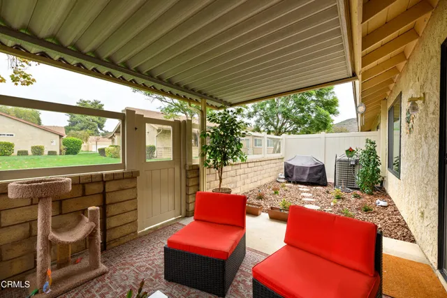 a outdoor space with patio the couches and a dining table with the garden view