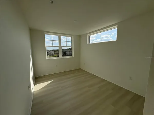 an empty room with windows