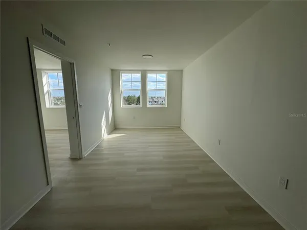 an empty room with windows