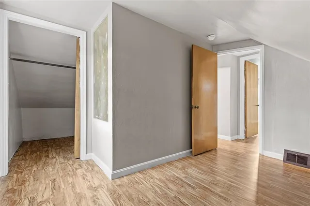 a view of entryway with wooden floor