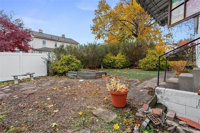 a view of a backyard with sitting area