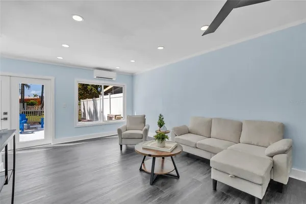 a living room with furniture and a window