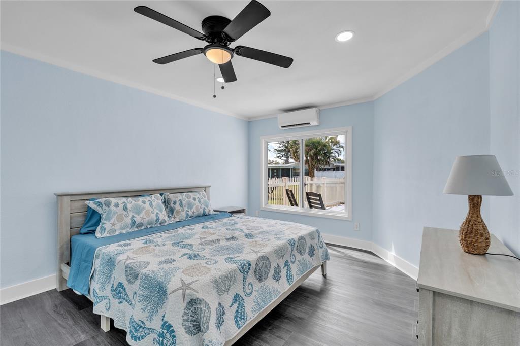 445 63rd Street Holmes Beach, FL 34217 - Photo 20 of 45 a bedroom with a large bed and a window
