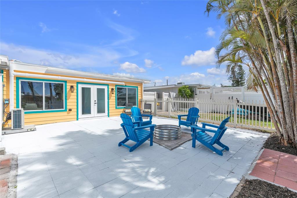 445 63rd Street Holmes Beach, FL 34217 - Photo 30 of 45 a outdoor space with patio furniture and garden