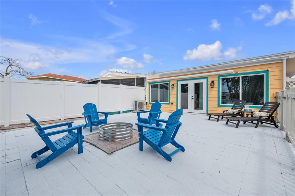 445 63rd Street Holmes Beach, FL 34217 - Photo 33 of 45 a outdoor space with lots of chairs and a couch