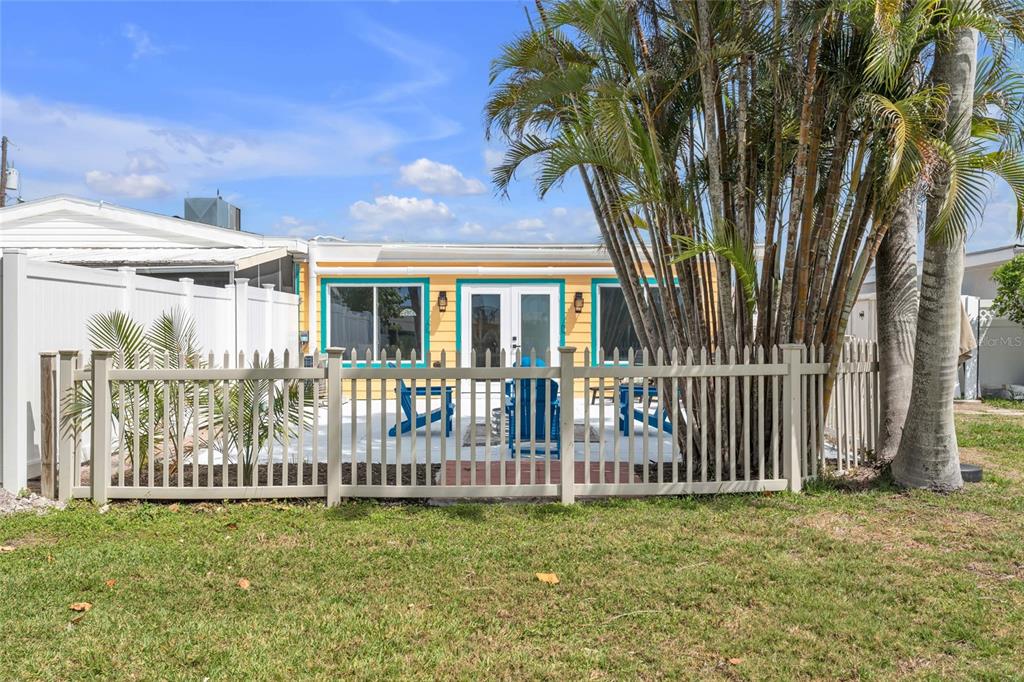 445 63rd Street Holmes Beach, FL 34217 - Photo 35 of 45 a front view of a house with a garden
