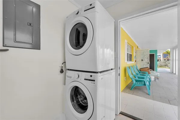 a view of a hallway with washer and dryer