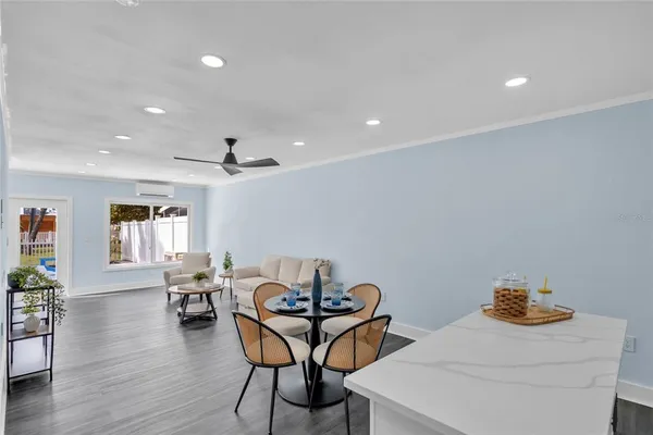 a dining room with furniture and window