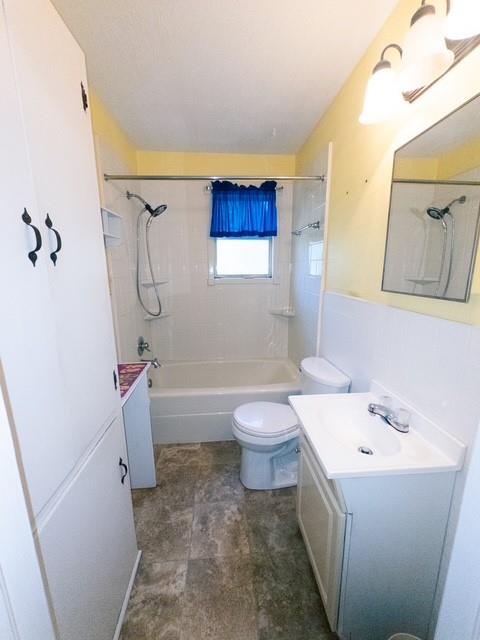 613 Laurel Road Athens, TX 75751 - Photo 11 of 13 Bathroom featuring a white bathtub, ceramic tile surround, built-in storage cabinetry, and a vanity with an integrated sink