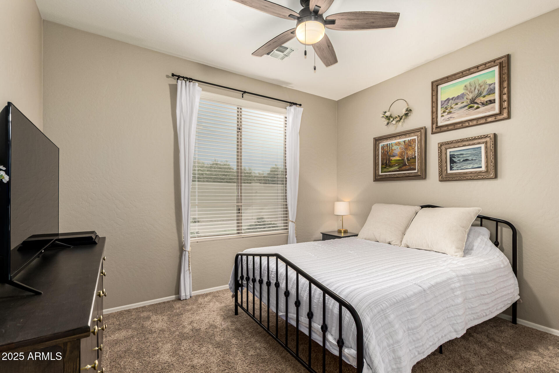 3721 South Martingale Road Gilbert, AZ 85297 - Photo 31 of 67 a bedroom with a large bed and a window