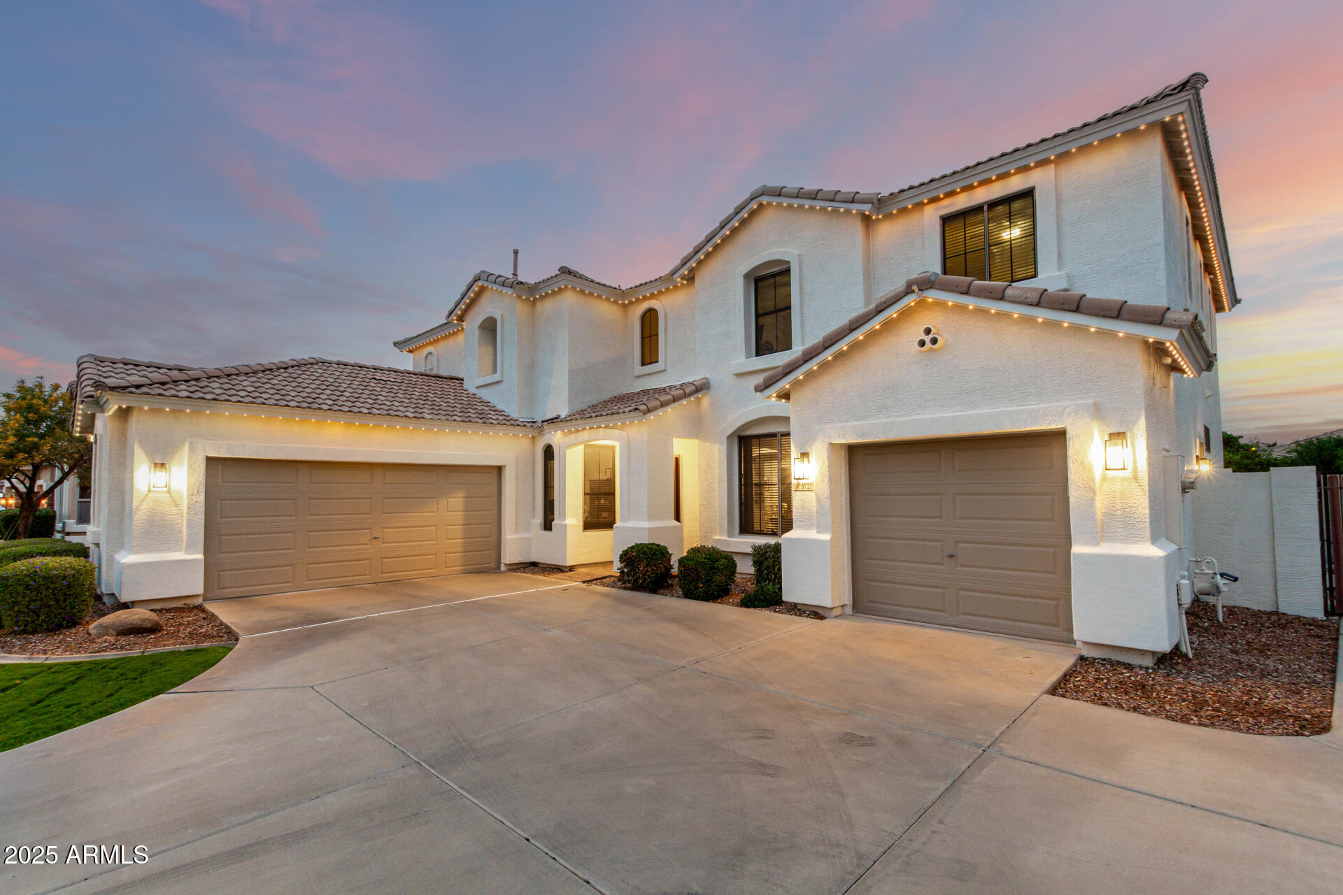 3721 South Martingale Road Gilbert, AZ 85297 - Photo 4 of 67 a view of a house with a yard and garage