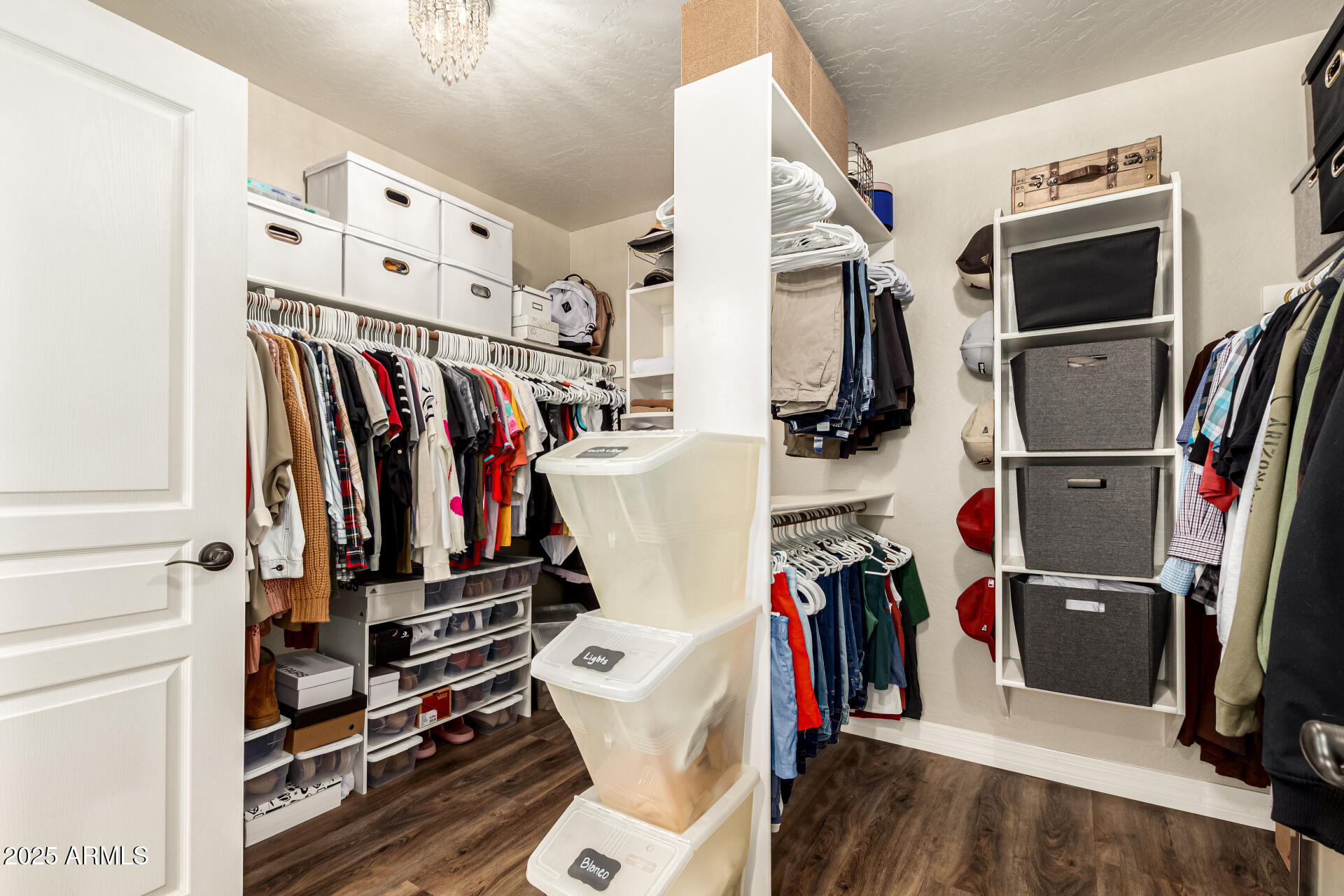 3721 South Martingale Road Gilbert, AZ 85297 - Photo 50 of 67 a view of walk in closet with clothes and shoes