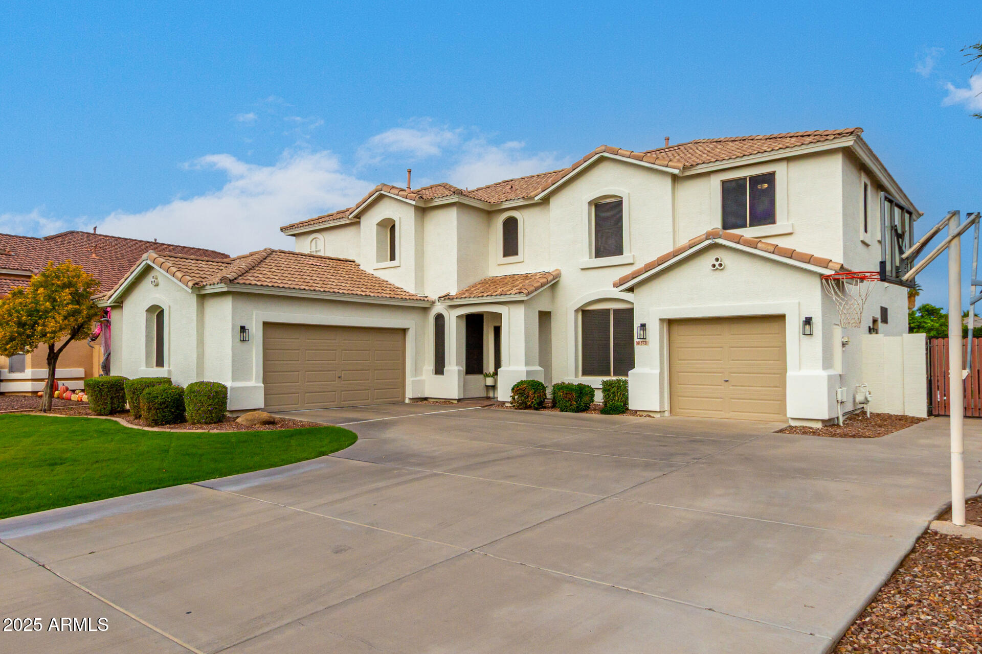 3721 South Martingale Road Gilbert, AZ 85297 - Photo 7 of 67 a front view of a house with a yard and garage