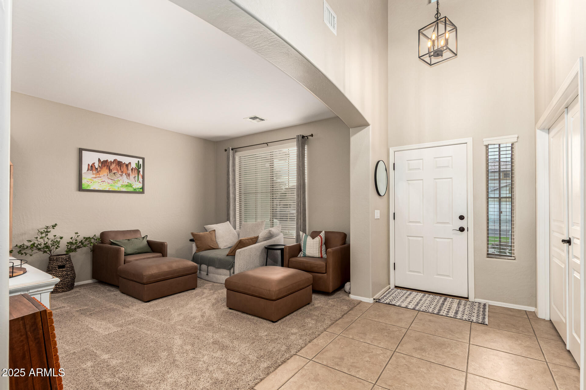 3721 South Martingale Road Gilbert, AZ 85297 - Photo 9 of 67 a living room with furniture and a window