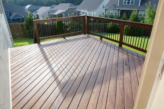 a view of balcony with wooden floor