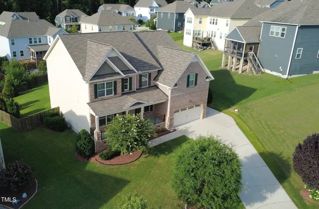 an aerial view of a house with a garden