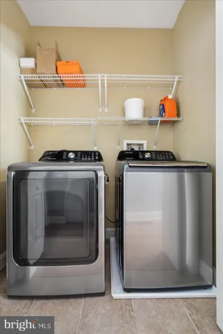 a stove top oven sitting inside of a kitchen