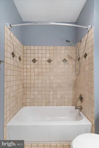 a bathroom with a shower and a bathtub