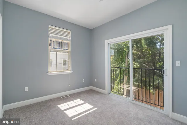 a view of empty room with floor to ceiling window