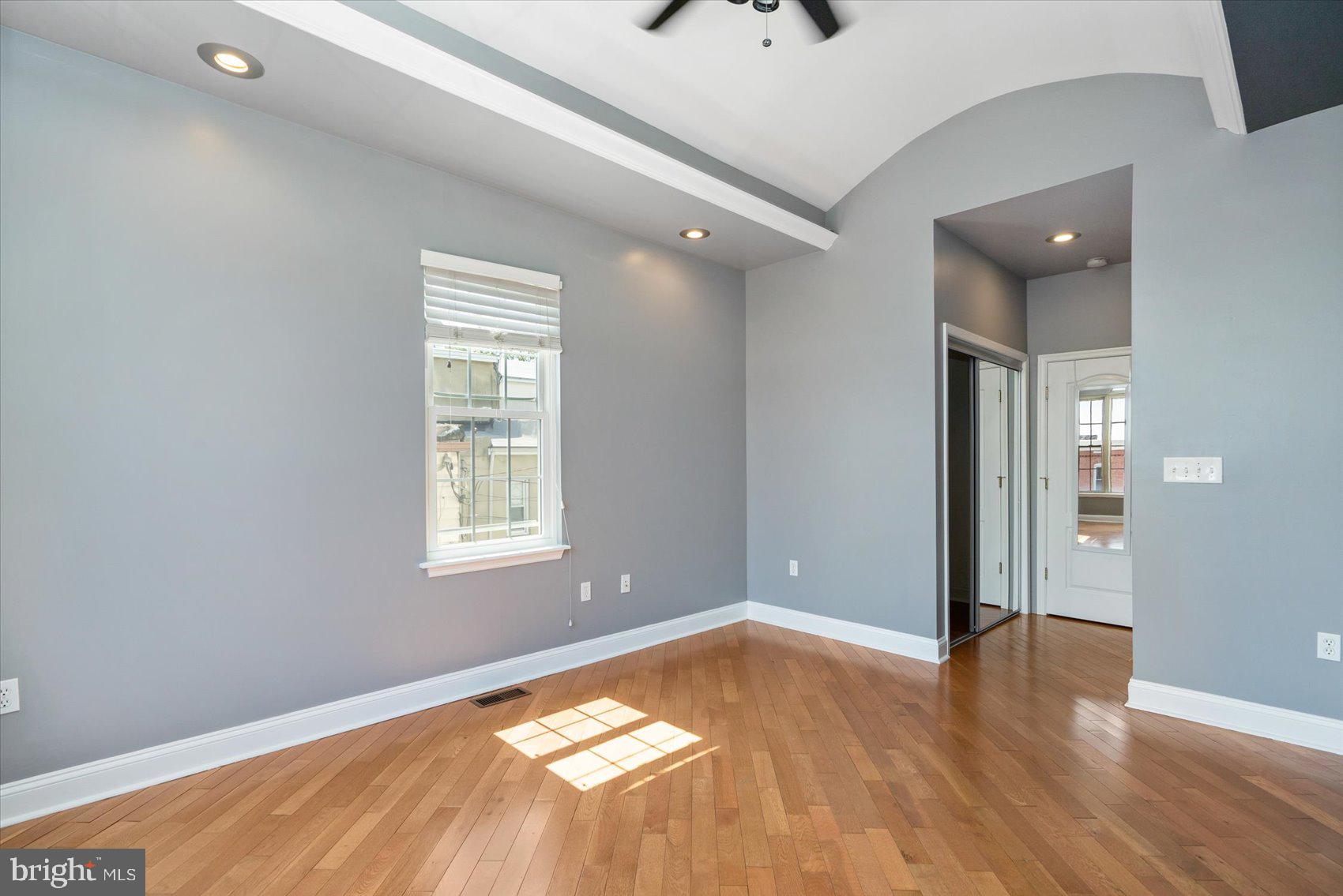 104 North Patterson Park Avenue Baltimore, MD 21231 - Photo 32 of 38 a view of a livingroom with wooden floor and a window